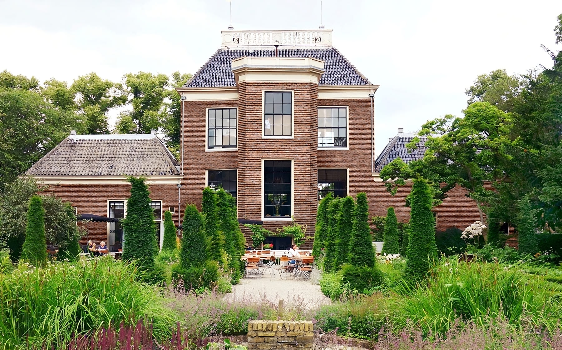 Two stories house with a facade made using artificial stone